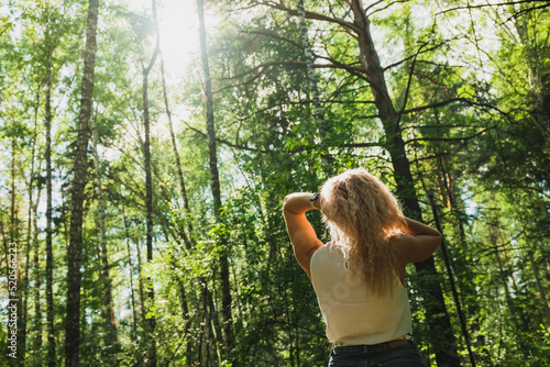 Wallpaper Mural The young woman walks in a forest on a sunny day
 Torontodigital.ca