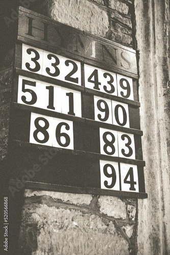 Canvas Print Hymn board for a service at Cockington Parish Church, Devon, England
