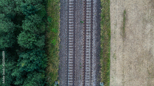 Train tracks through German forest near Munich aerial drone view fotage