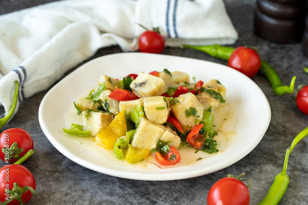 Artichoke Salad. Artichoke salad with olive oil on a dark background. Healthy meals. close up Artichoke Salad. Artichoke salad with olive oil on a dark background. Healthy meals. close up