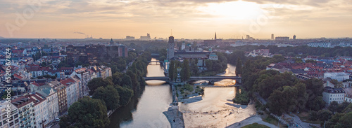 Aerial view of Munich city centre with Isar river flowing past the Deutsches Museum at sunrise