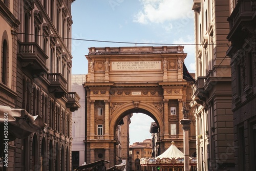 Fototapeta Scenic shot of buildings and archways in Florence, Italy