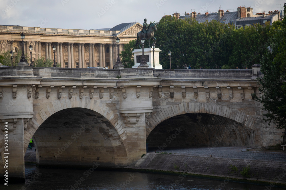 The Pont Neuf over the Seine River in the French city of Paris with beautiful monuments. Paris is divided by the Seine river and this beautiful European city is full of beautiful bridges. The Pont Neuf over the Seine River in the French city of Paris with beautiful monuments. Paris is divided by the Seine river and this beautiful European city is full of beautiful bridges.