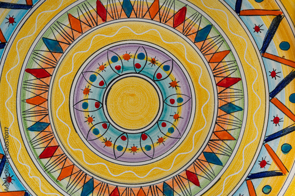 Abstract ceramic background. Italian traditional patterns on tiles, handmade craft painting - circles, mandala, pattern.