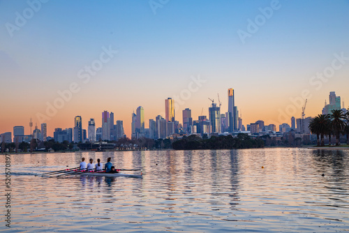 Melbourne city skyline behind Albert Park lake in the pre-dawn light 