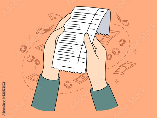 Person holding bill checking expenses