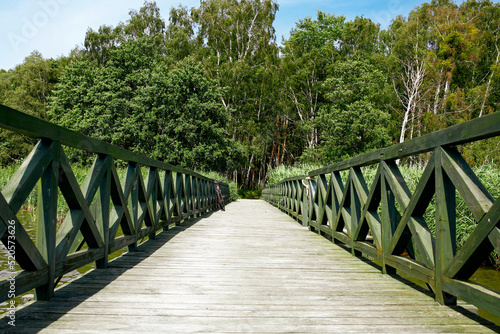 wooden pier on Lebsko lake in Slowinski National Park, Leba, northern Poland