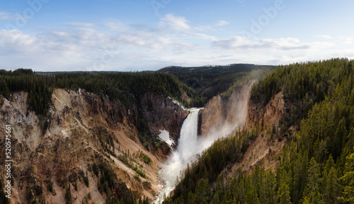 Rocky Canyon  River and Waterfall in American Landscape. Grand Canyon of The Yellowstone. Cloudy Sky Art Render. Yellowstone National Park. United States. Nature Background.