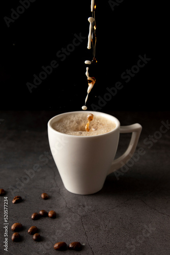 Filling a coffee cup with coffee and milk