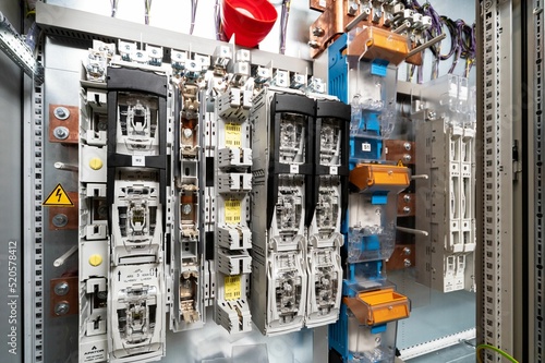 Canvas Print Closeup shot of an electrical switchboard with wires and fuses