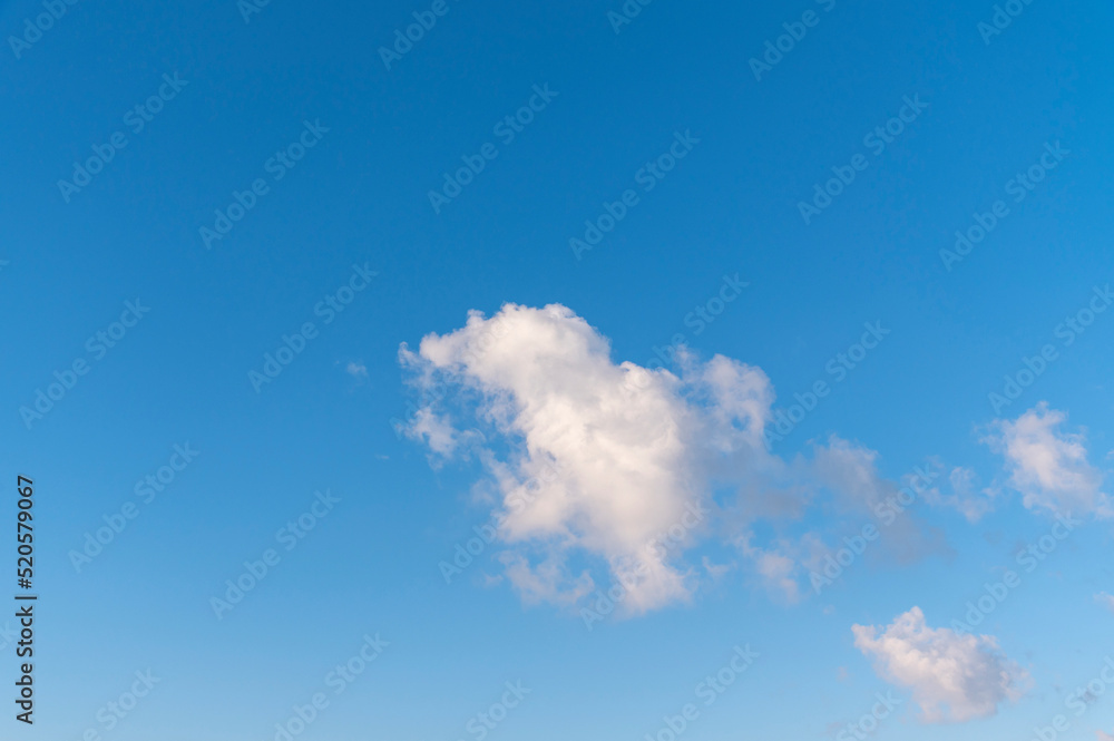 Blue sky and white fluffy tiny clouds background and pattern Blue sky and white fluffy tiny clouds background and pattern