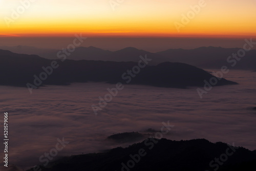 Landscape of the mountain and sea of mist in winter gold sunrise view from top of Phu Chi Dao mountain , Chiang Rai, Thailand