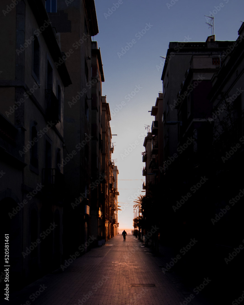 Man during sunrise in barcelona spain street photography