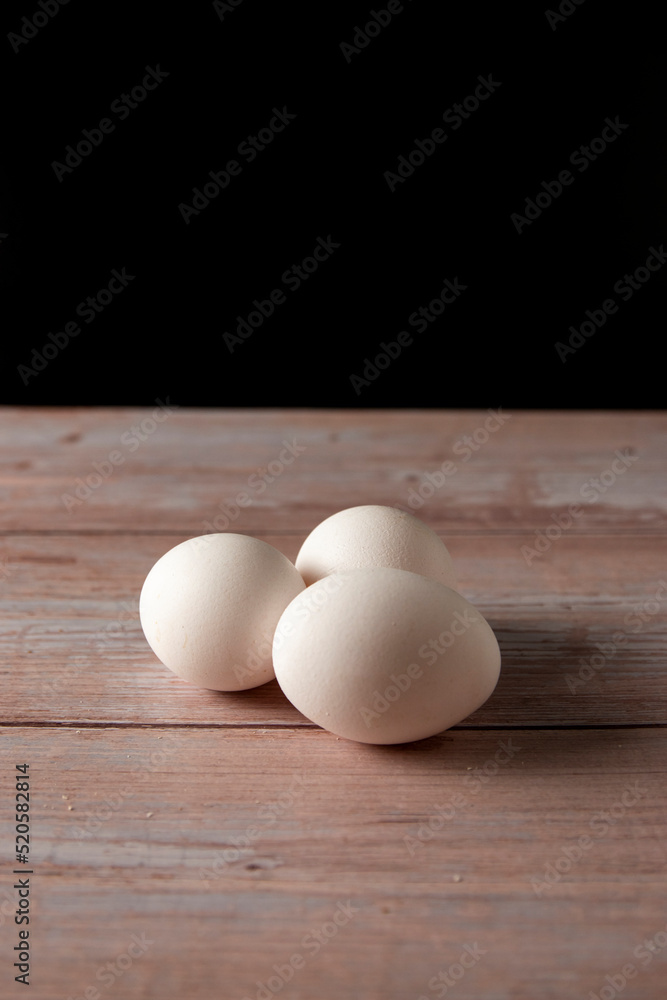 Fresh free range eggs on wooden table
