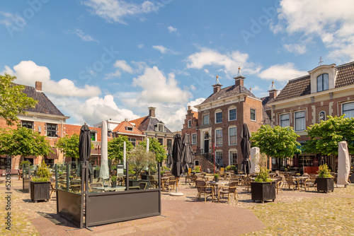 Summer view of the city center square with pubs and restaurants in Workum, Friesland, The Netherlands photo
