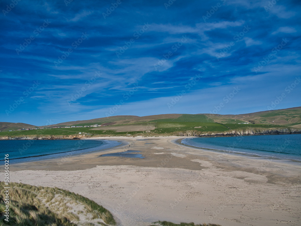 The sand spit, or tombolo, that joins St Ninian's Isle to Mainland Shetland - taken from the island looking across to the farmland of south Mainland.
