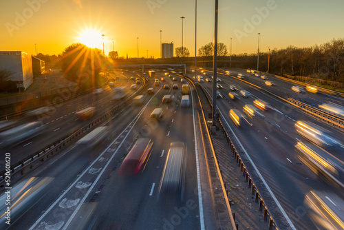 Sunset over M8 motorway traffic, Glasgow, Scotland, United Kingdom photo