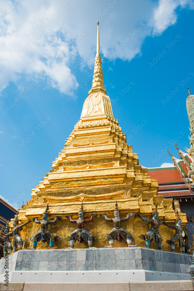 Naklejka premium Panorama of complex of Temple of Emerald Buddha, view to ornate Royal Pantheon, gold chedi and stupas. Grand Palace, Bangkok, Thailand