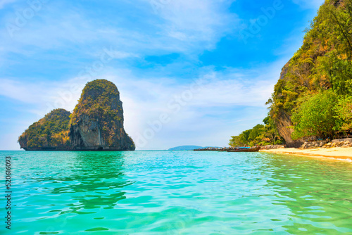 Tropical beach landscape Phra Nang with clear water, rocky mountain and island in sea