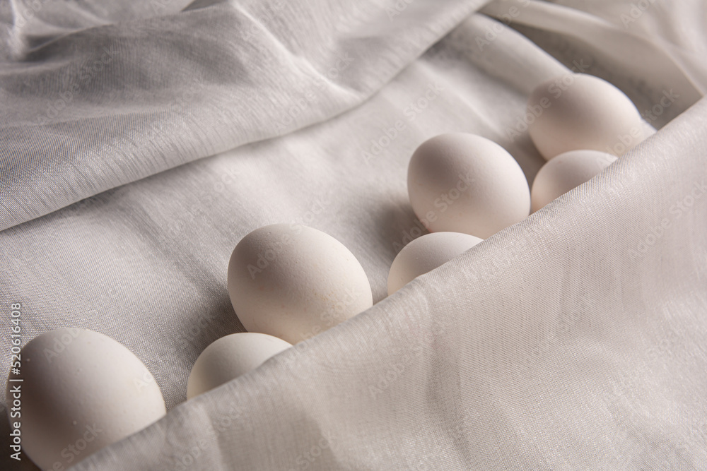 Chicken white eggs on burlap. Farm products. Natural eggs. Chicken eggs on the table. Chicken white eggs on burlap. Farm products. Natural eggs. Chicken eggs on the table.