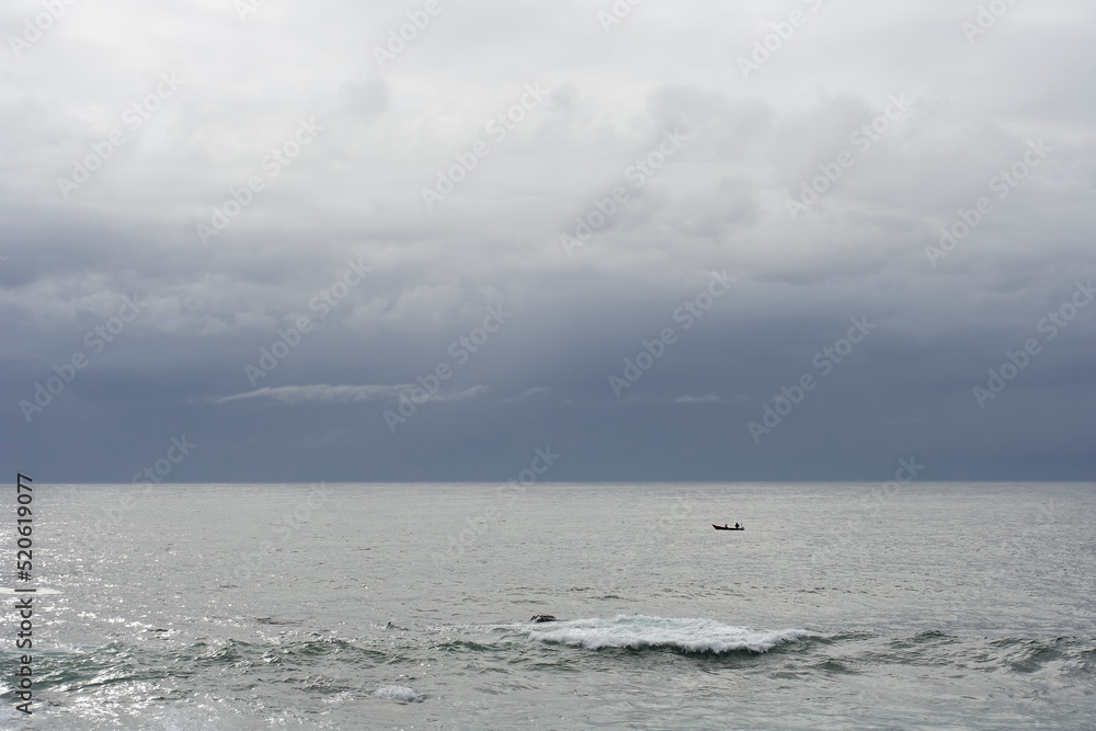 Lonely small fishing boat in the sea