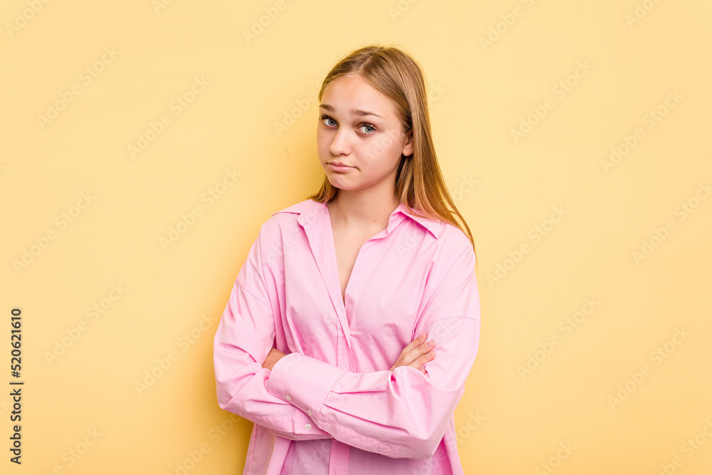 Young caucasian girl isolated on yellow background unhappy looking in camera with sarcastic expression. Young caucasian girl isolated on yellow background unhappy looking in camera with sarcastic expression.