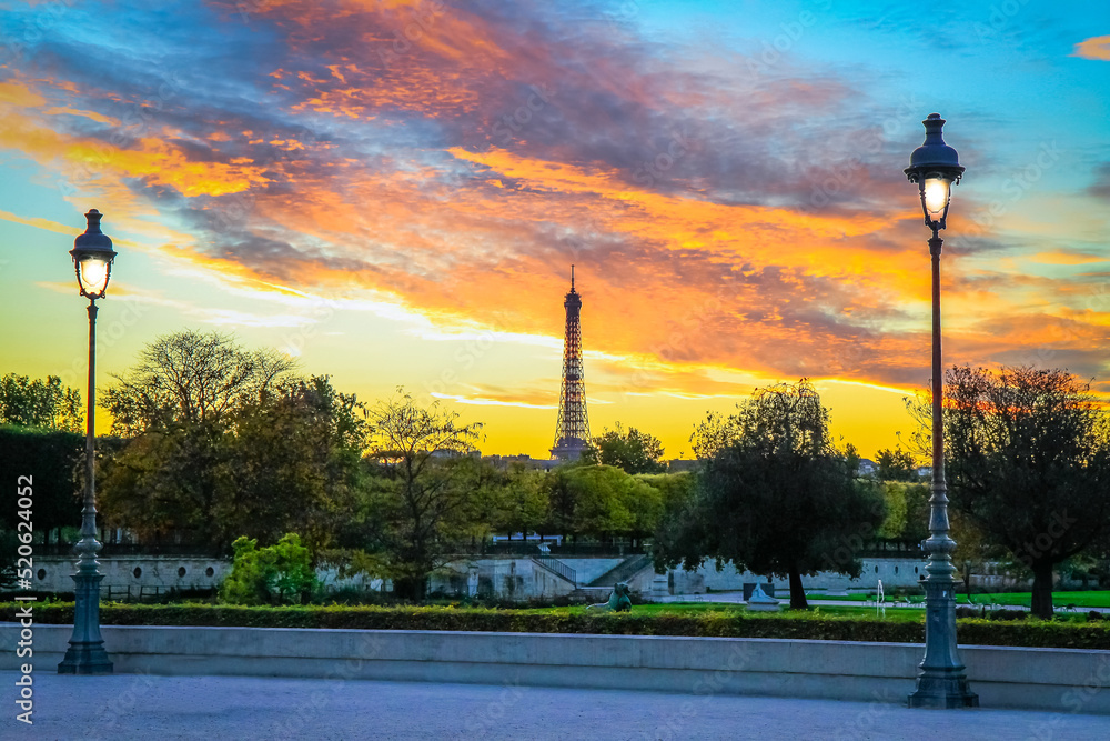 Eiffel tower from Tuileries gardens at dramatic sunset, Paris, France