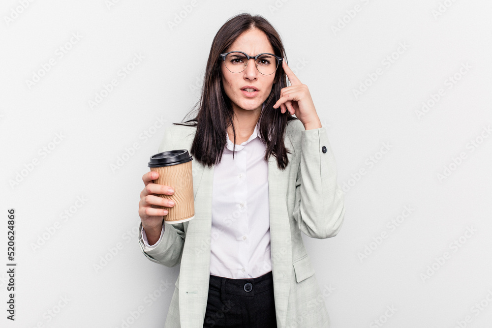 Young business caucasian woman holding takeaway coffee isolated on white background showing a disappointment gesture with forefinger. Young business caucasian woman holding takeaway coffee isolated on white background showing a disappointment gesture with forefinger.