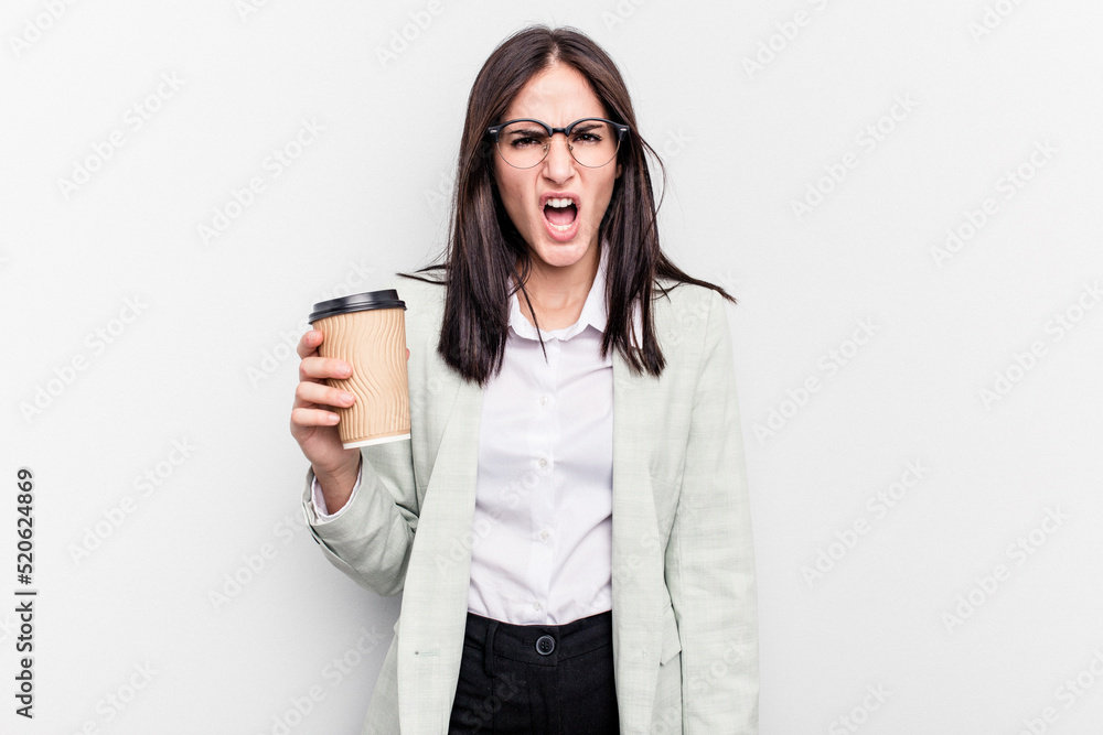 Young business caucasian woman holding takeaway coffee isolated on white background screaming very angry and aggressive. Young business caucasian woman holding takeaway coffee isolated on white background screaming very angry and aggressive.