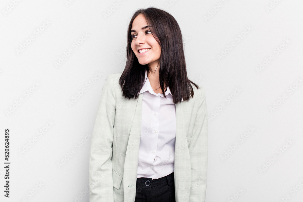 Young business caucasian woman isolated on white background looks aside smiling, cheerful and pleasant. Young business caucasian woman isolated on white background looks aside smiling, cheerful and pleasant.