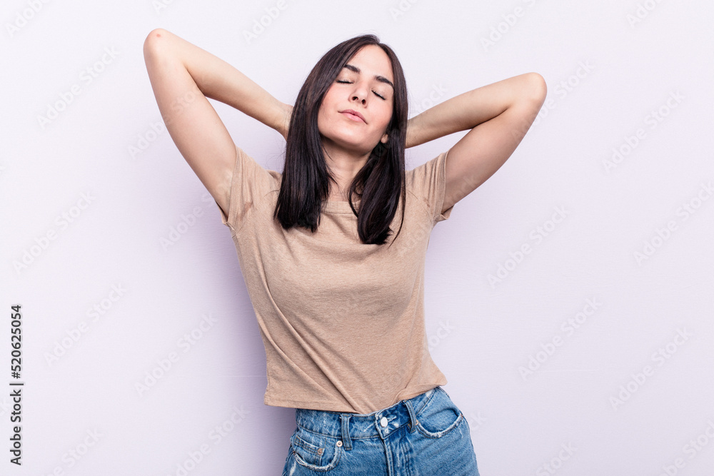 Young caucasian woman isolated on pink background feeling confident, with hands behind the head. Young caucasian woman isolated on pink background feeling confident, with hands behind the head.