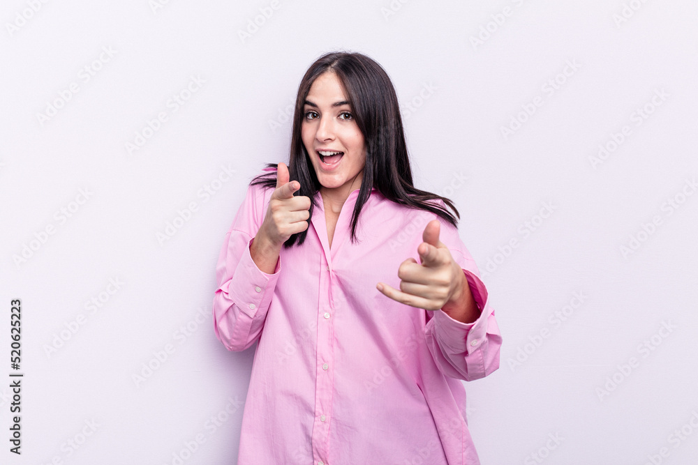 Young caucasian woman isolated on pink background cheerful smiles pointing to front. Young caucasian woman isolated on pink background cheerful smiles pointing to front.