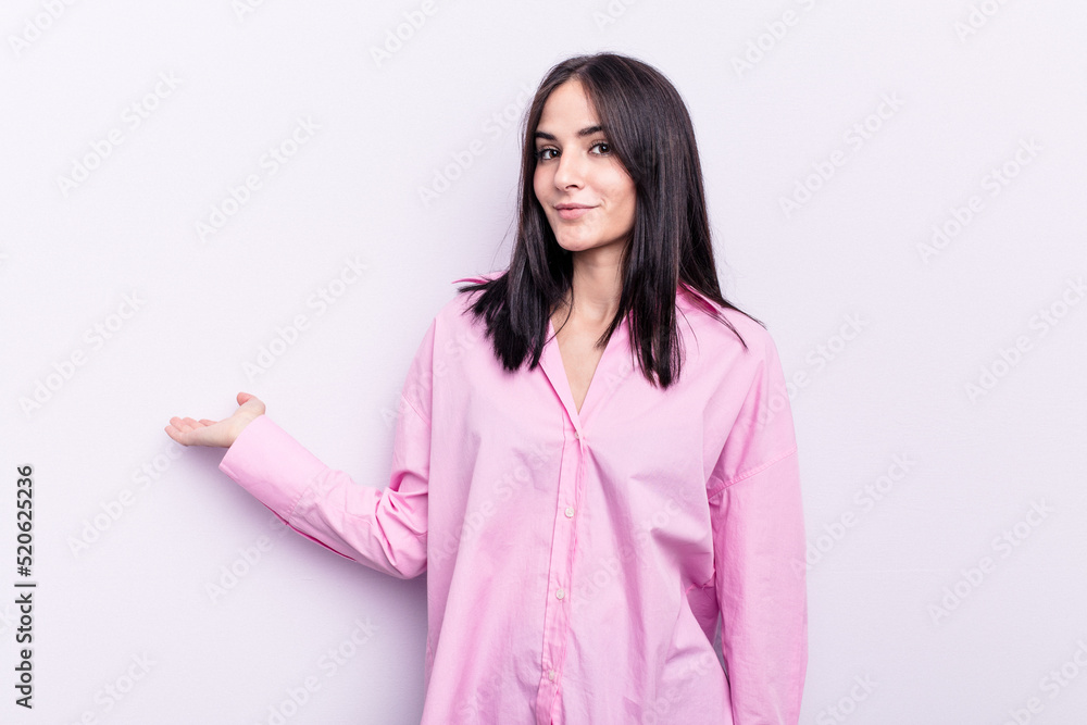 Young caucasian woman isolated on pink background showing a welcome expression. Young caucasian woman isolated on pink background showing a welcome expression.