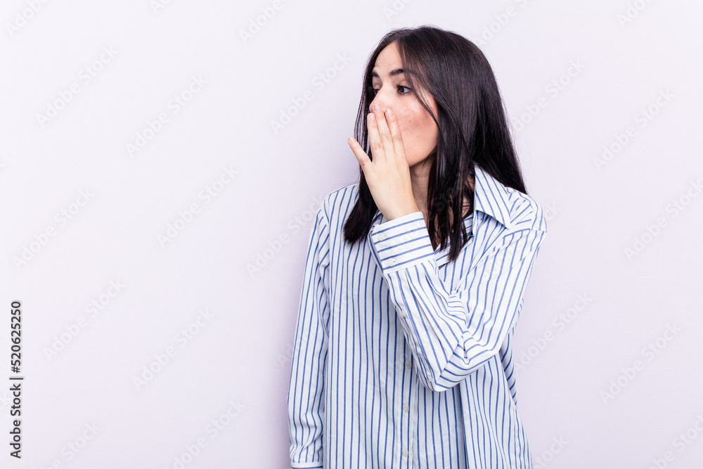 Young caucasian woman isolated on pink background being shocked because of something she has seen. Young caucasian woman isolated on pink background being shocked because of something she has seen.