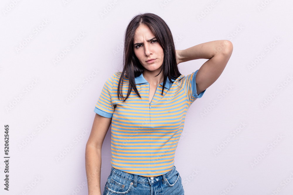Young caucasian woman isolated on pink background massaging elbow, suffering after a bad movement. Young caucasian woman isolated on pink background massaging elbow, suffering after a bad movement.