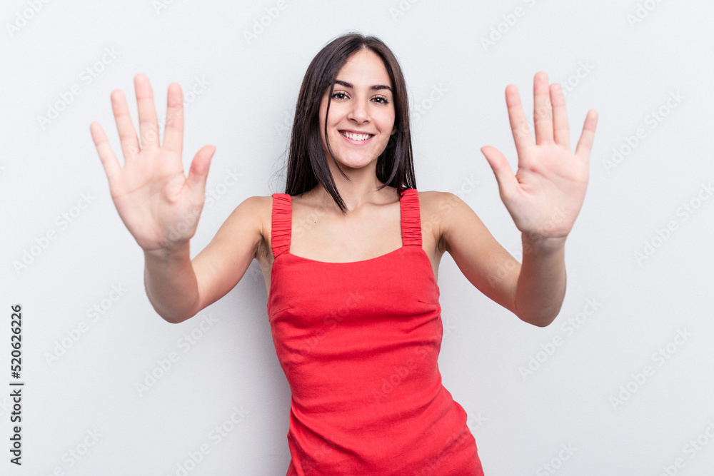 Young caucasian woman isolated on white background showing number ten with hands. Young caucasian woman isolated on white background showing number ten with hands.