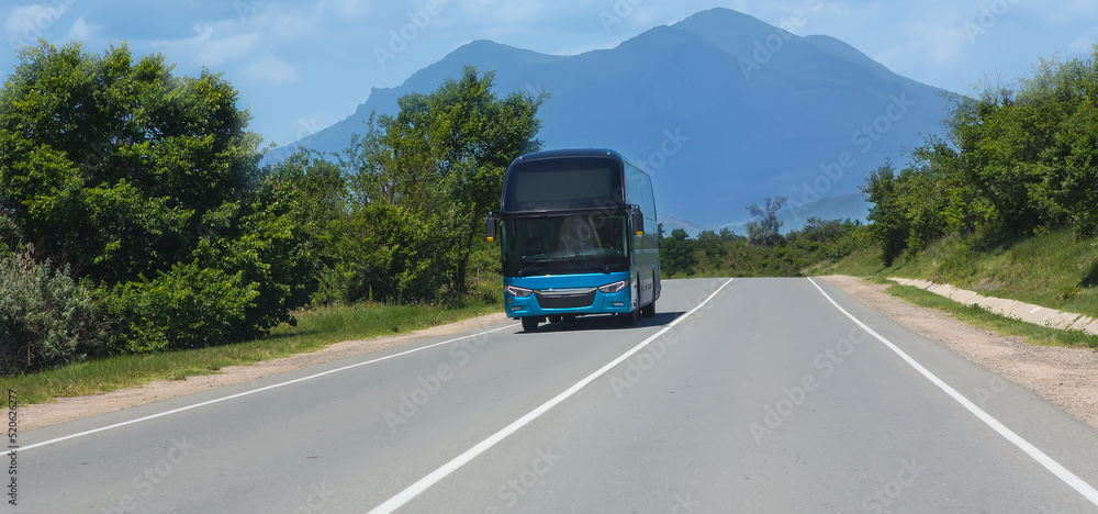 bus moves along a suburban highway