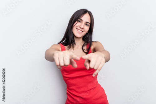 Young caucasian woman isolated on white background pointing to front with fingers.