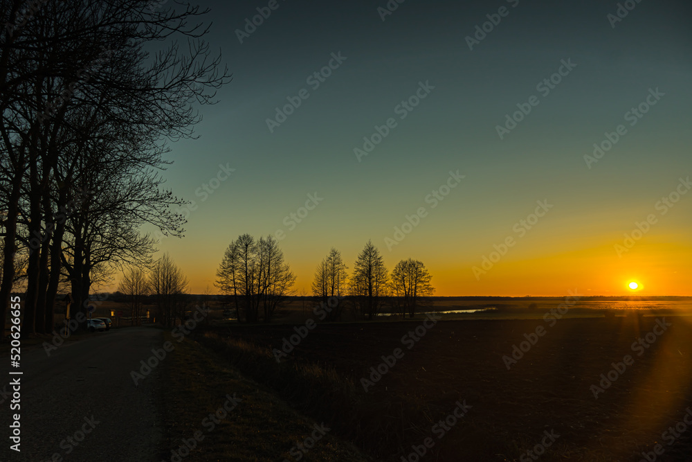 Obraz premium Sunset in the Narew River valley in thee Sunset in the Narew River valley in the Narew National Park.