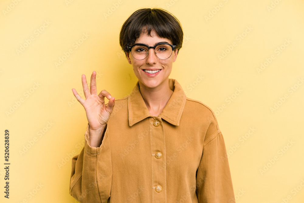 Young caucasian woman with a short hair cut isolated cheerful and confident showing ok gesture. Young caucasian woman with a short hair cut isolated cheerful and confident showing ok gesture.