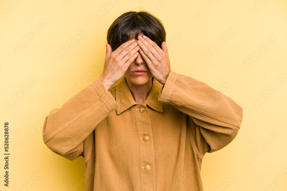 Young caucasian woman with a short hair cut isolated afraid covering eyes with hands. Young caucasian woman with a short hair cut isolated afraid covering eyes with hands.