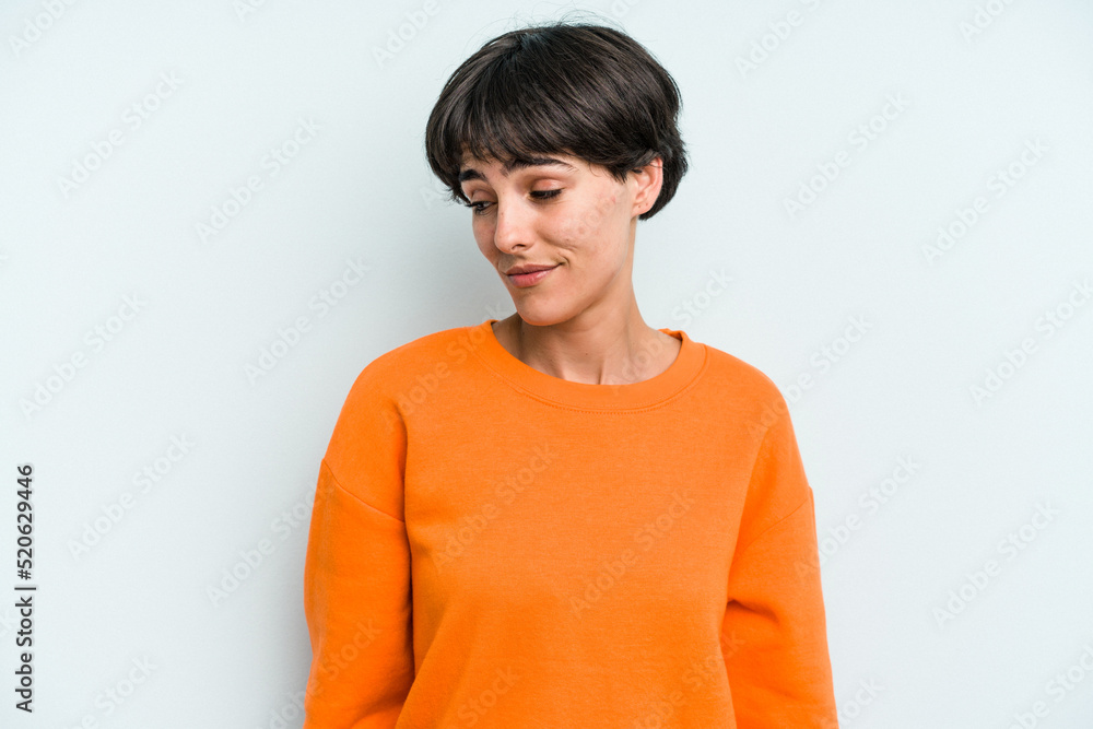 Young caucasian woman with a short hair cut isolated shrugs shoulders and open eyes confused. Young caucasian woman with a short hair cut isolated shrugs shoulders and open eyes confused.