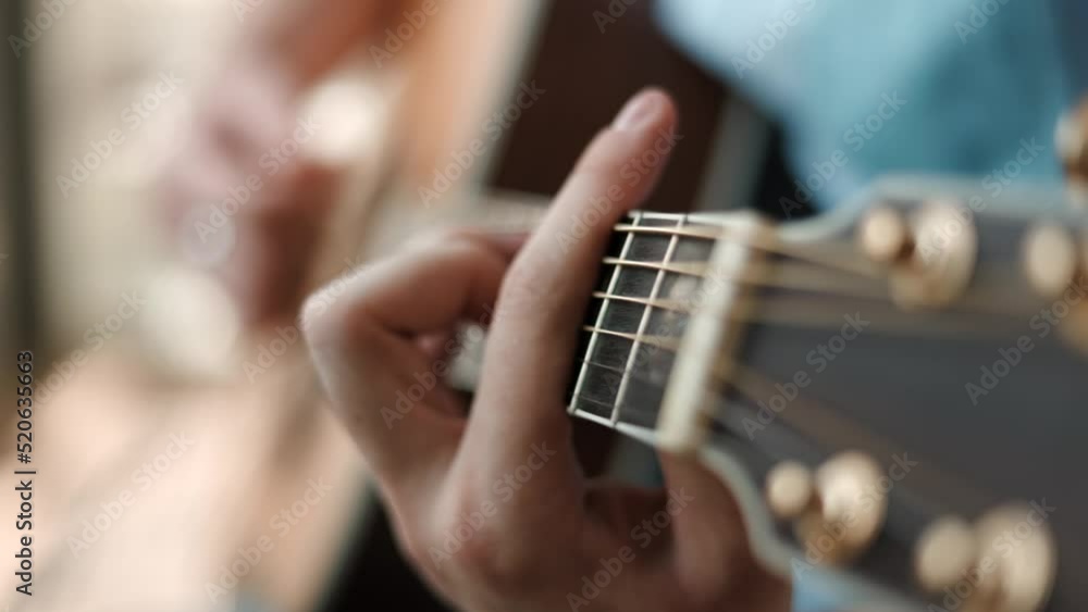 Man Playing Guitar Close- Man playing guitar chords close up.
Man Playing Guitar Close- Man playing guitar chords close up.
