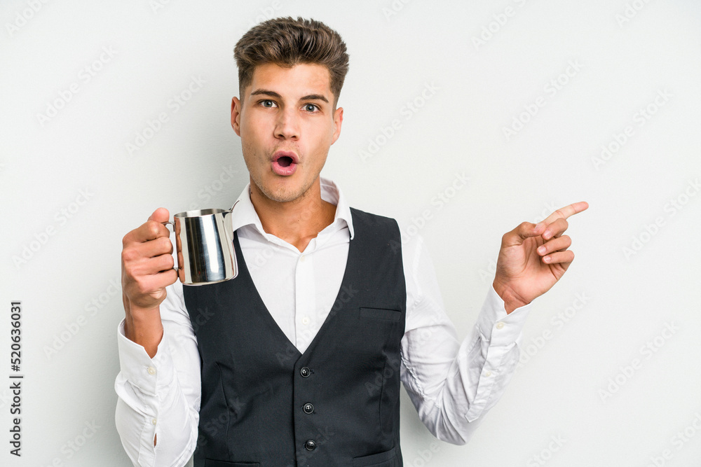 Young caucasian barista man isolated on yellow background pointing to the side Young caucasian barista man isolated on yellow background pointing to the side