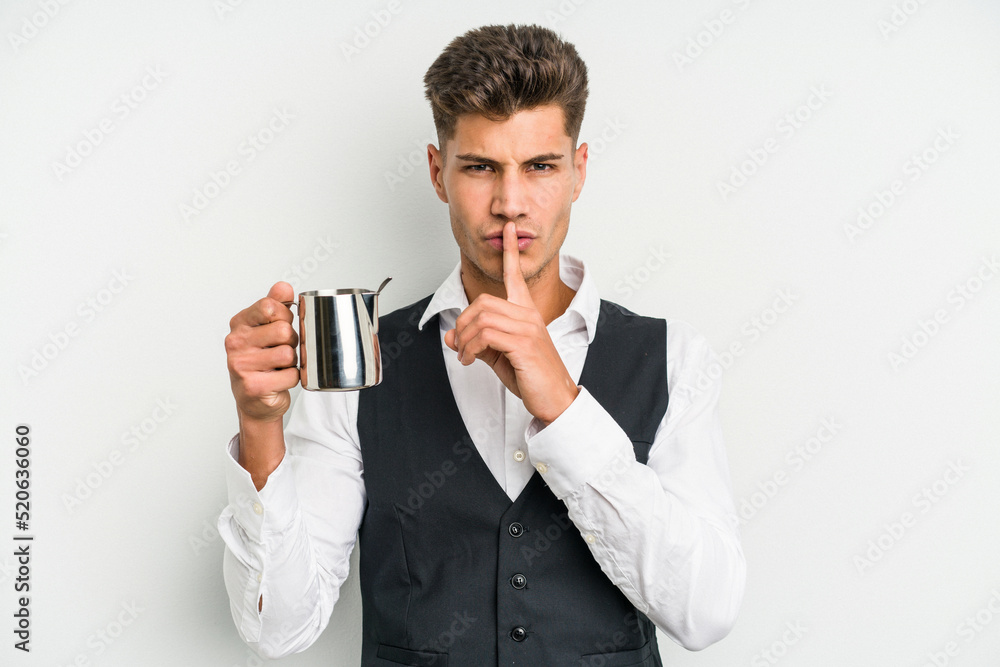 Young caucasian barista man isolated on yellow background keeping a secret or asking for silence. Young caucasian barista man isolated on yellow background keeping a secret or asking for silence.