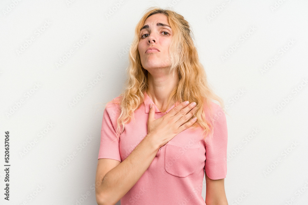 Young caucasian woman isolated on white background taking an oath, putting hand on chest. Young caucasian woman isolated on white background taking an oath, putting hand on chest.