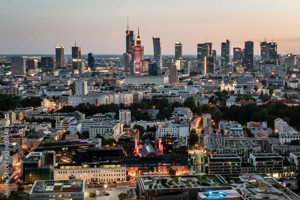 Poland, Warsaw capital city during twilight. Aerial drone view.