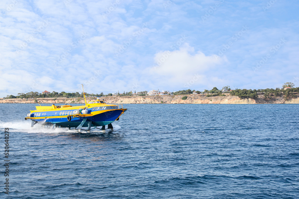 Modern passenger hydrofoil boat in sea on sunny day
