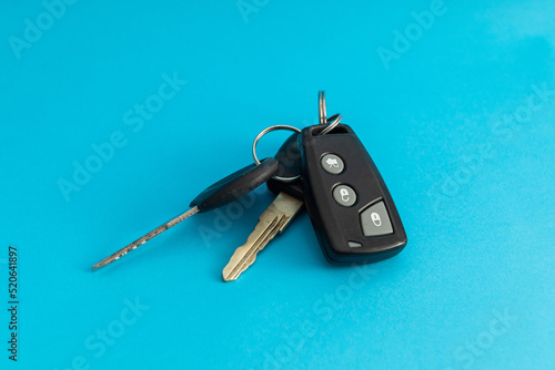 Car keys on blue background