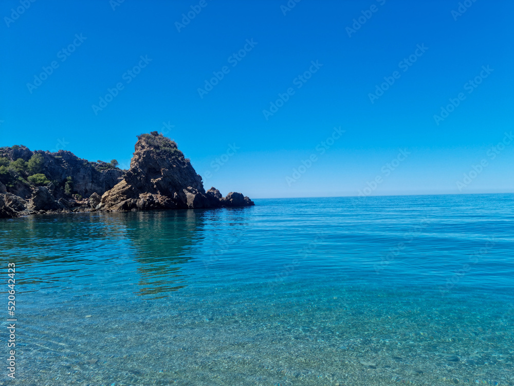 Panoramic view of Cala del Cañuelo beach in Malaga Panoramic view of Cala del Cañuelo beach in Malaga